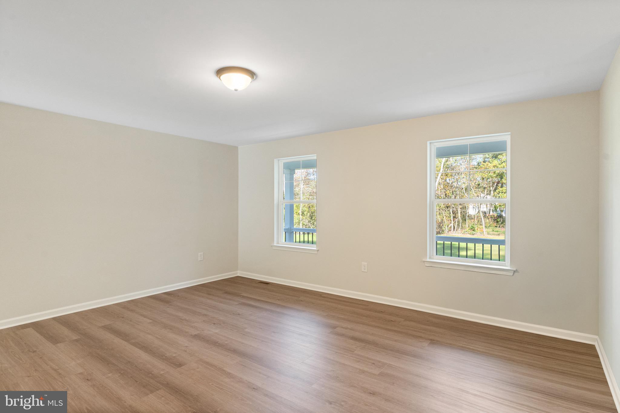 765 Little Mill Road Monroeville, NJ 08343 - Photo 8 of 39 a view of an empty room with wooden floor and a window