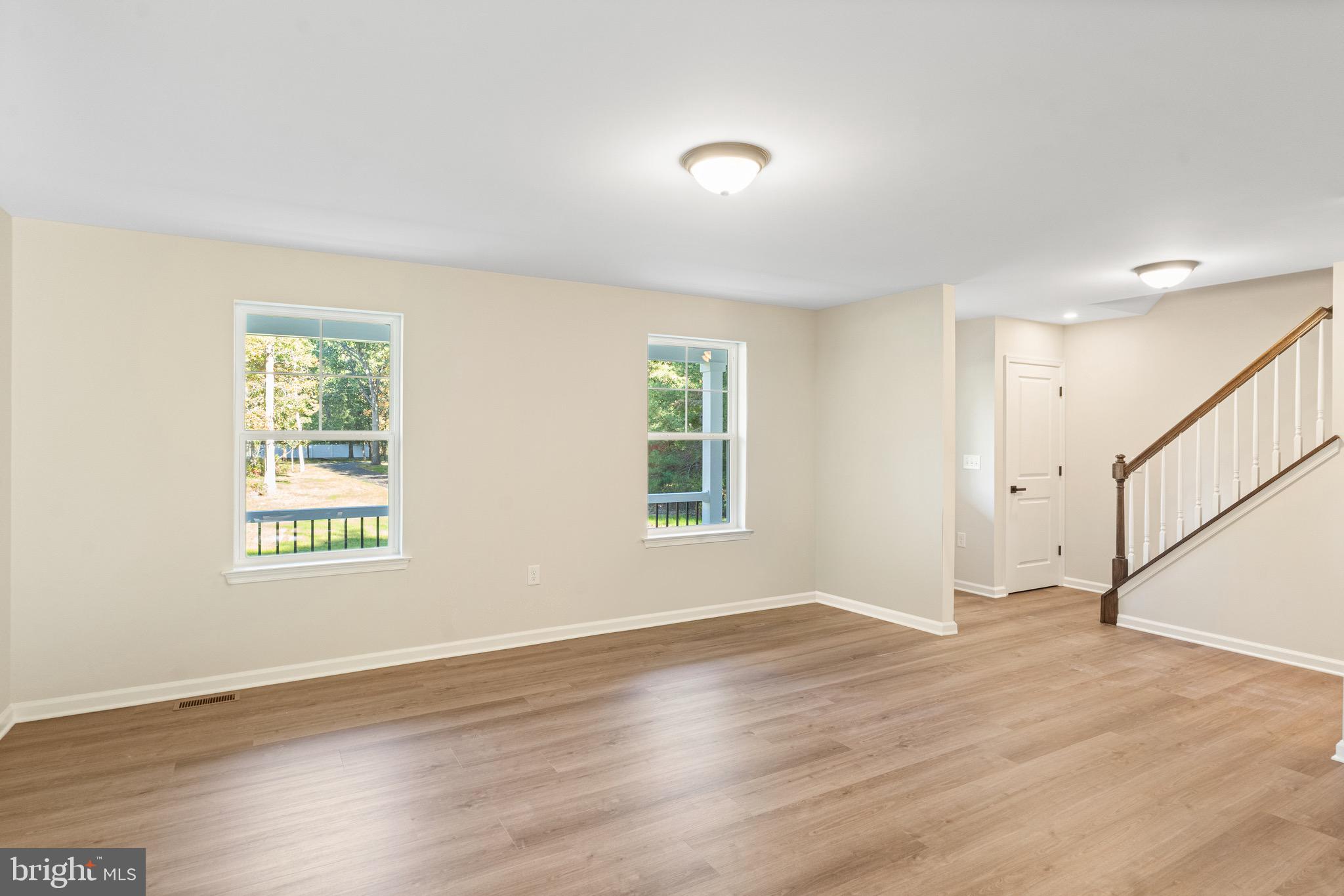 765 Little Mill Road Monroeville, NJ 08343 - Photo 9 of 39 a view of an empty room with wooden floor and a window