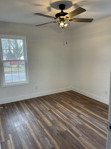 a bathroom with a toilet and a bathtub
