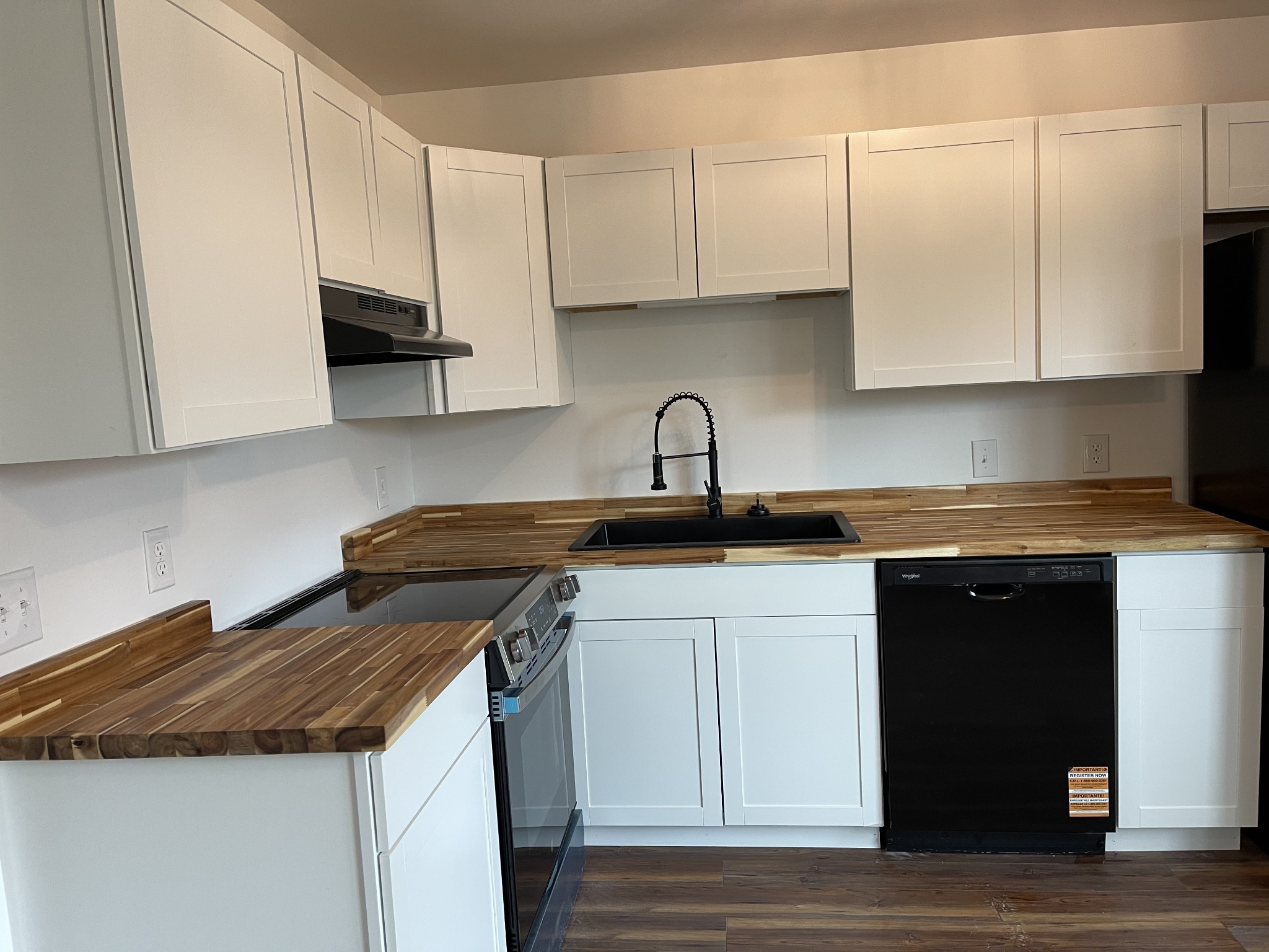 255 Maple Street Savannah, TN 38372 - Photo 8 of 20 a kitchen with stainless steel appliances granite countertop a sink a stove and a microwave
