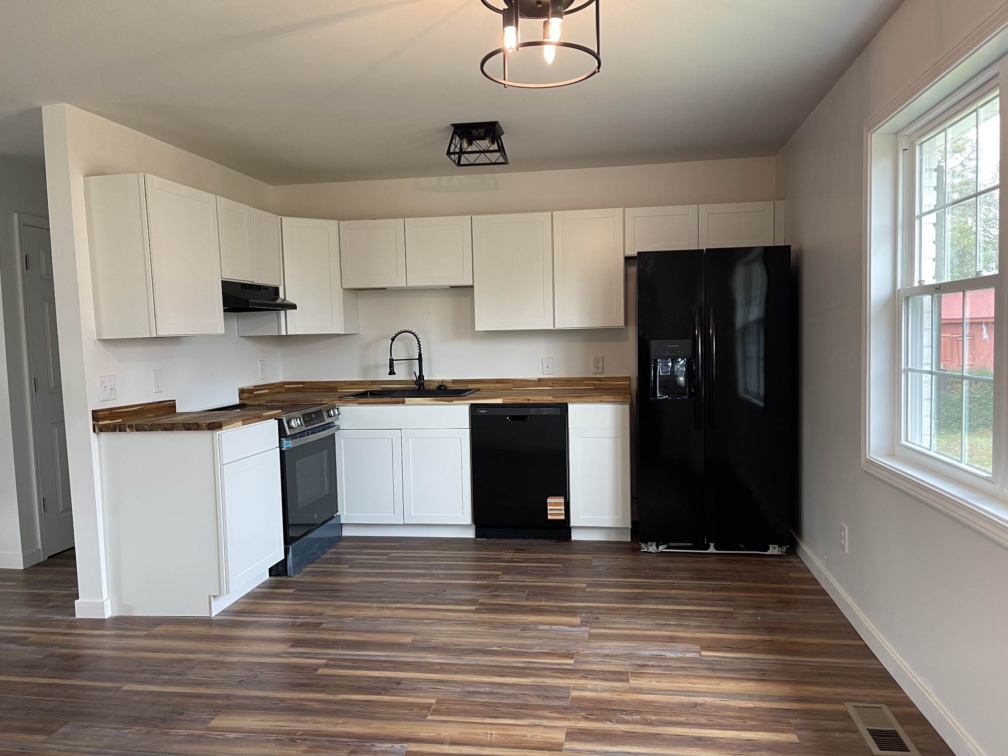 255 Maple Street Savannah, TN 38372 - Photo 10 of 20 a kitchen with a stove top oven and refrigerator