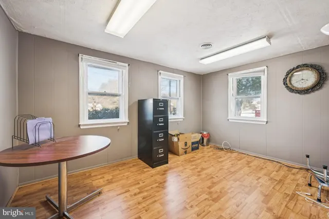 a bedroom with a bed and a table