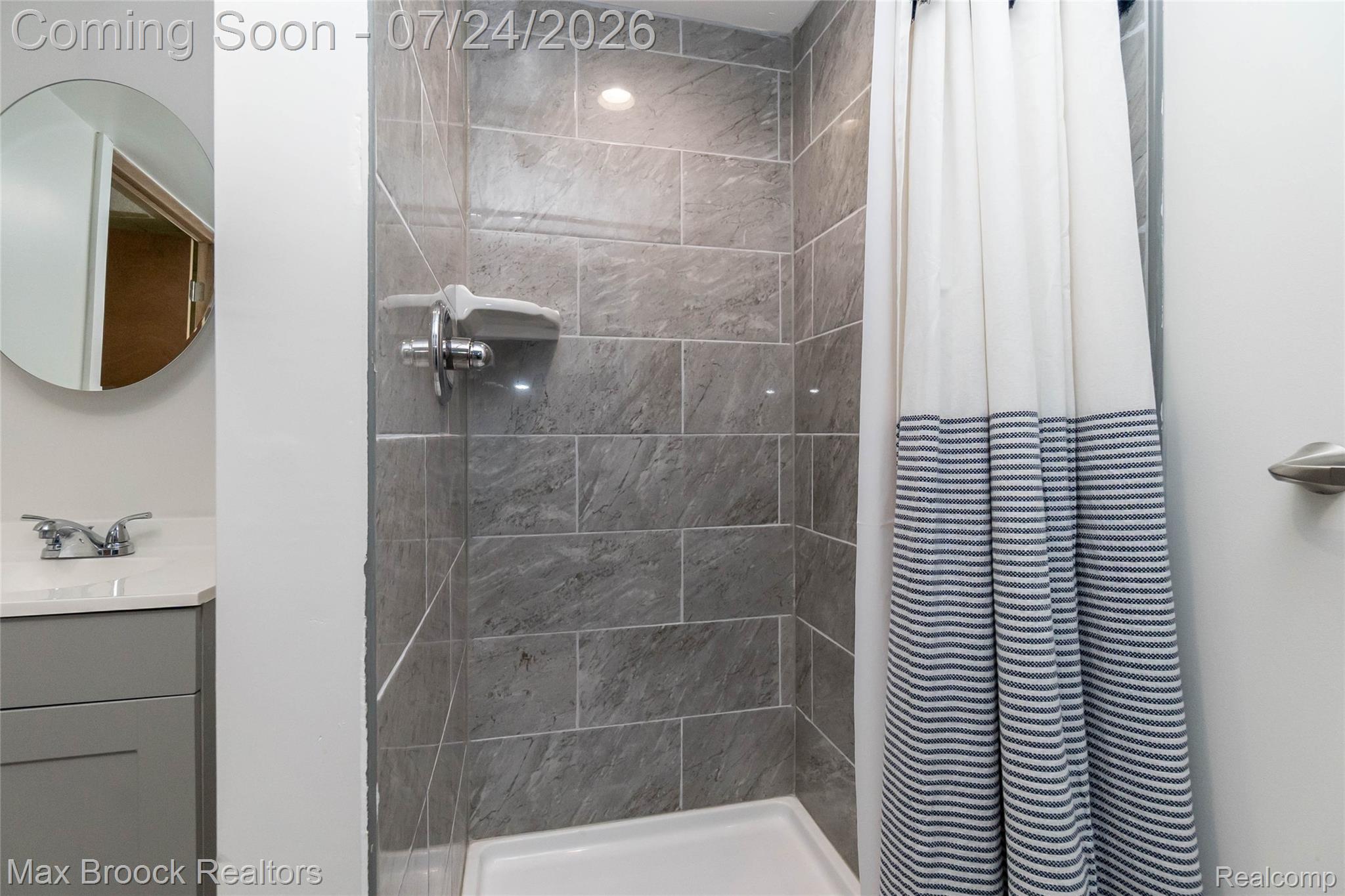 1090 Cambridge Road Berkley, MI 48072 - Photo 28 of 43 Shower stall featuring a tiled surround, recessed lighting, and a white shower pan