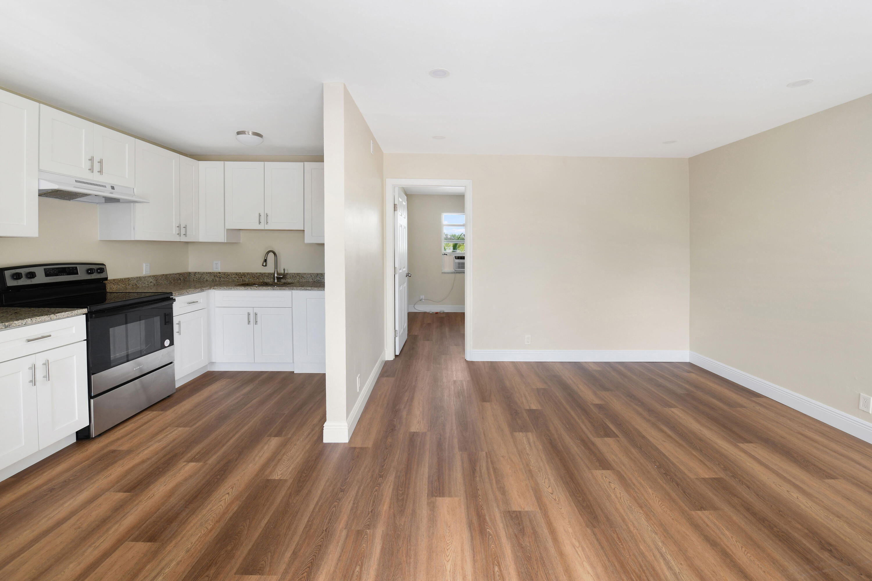 901 North F Street, Unit 8 Lake Worth Beach, FL 33460 - Photo 2 of 15 a view of kitchen with wooden floor and electronic appliances