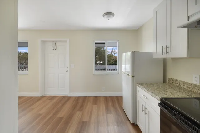 an empty room with wooden floor