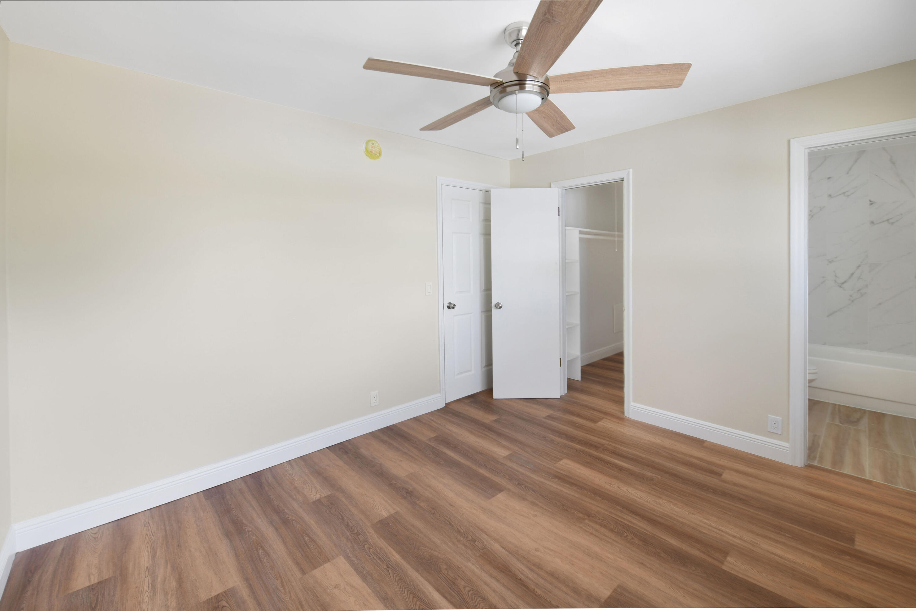 901 North F Street, Unit 8 Lake Worth Beach, FL 33460 - Photo 10 of 15 wooden floor in an empty room