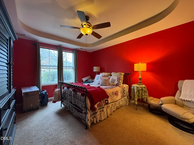 a bed room with a bed and a chandelier