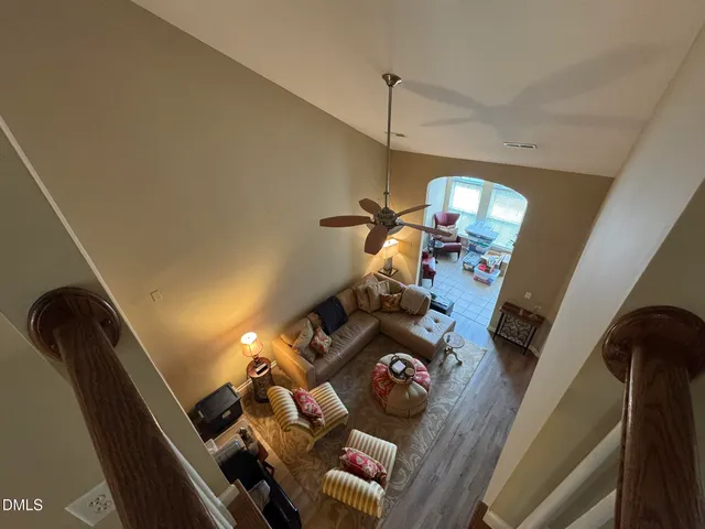 a view of living room with furniture and a chandelier