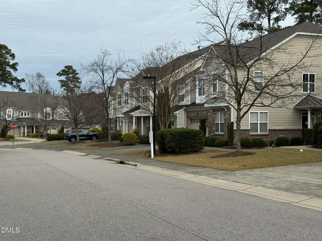 a view of a street with a building in the background