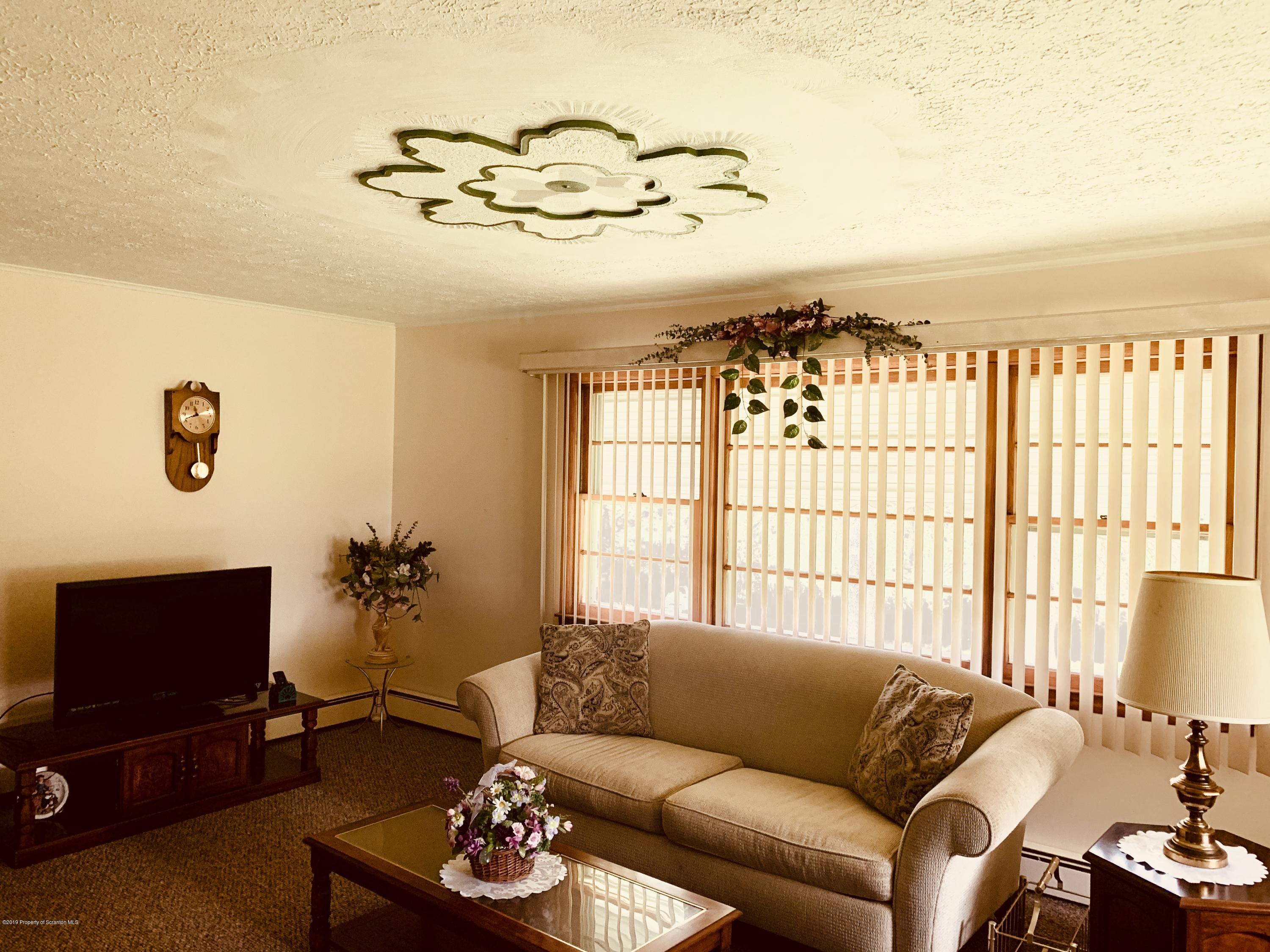 797 Cortez Road Lake Ariel, PA 18436 - Photo 5 of 15 a living room with furniture chandelier and a flat screen tv