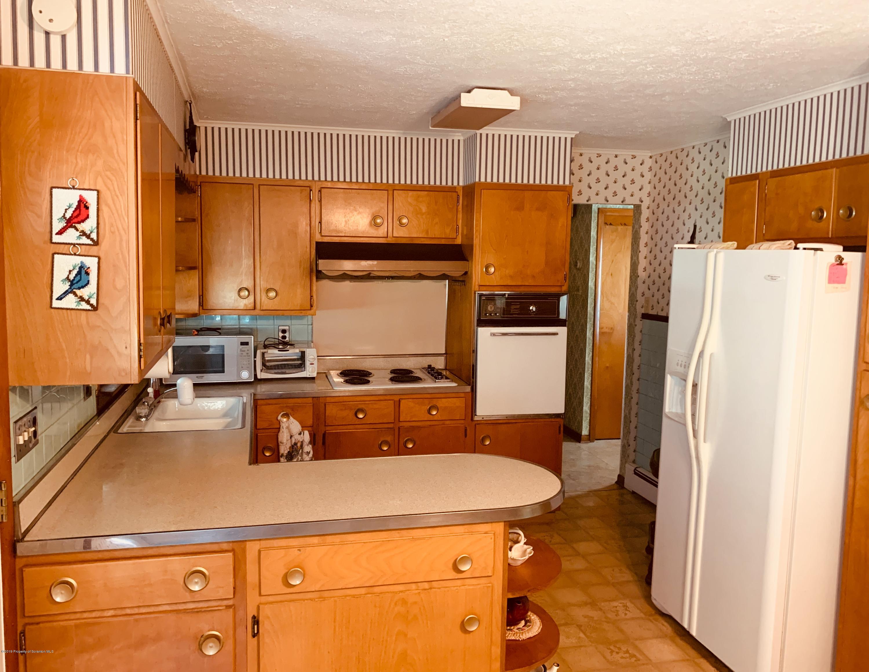797 Cortez Road Lake Ariel, PA 18436 - Photo 6 of 15 a kitchen with stainless steel appliances a refrigerator and a stove