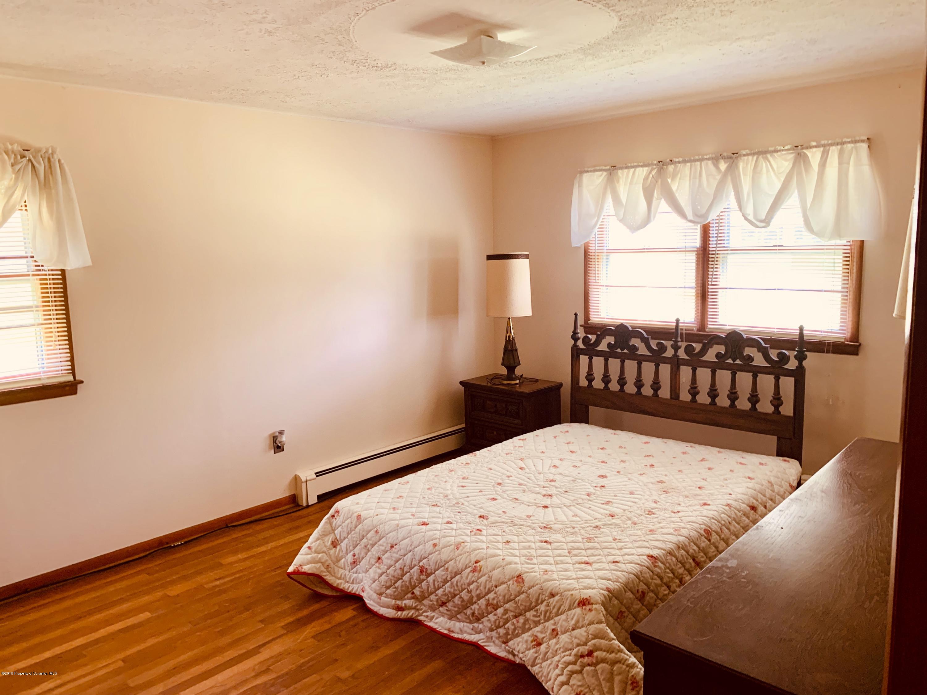797 Cortez Road Lake Ariel, PA 18436 - Photo 10 of 15 a bedroom with a bed and a window