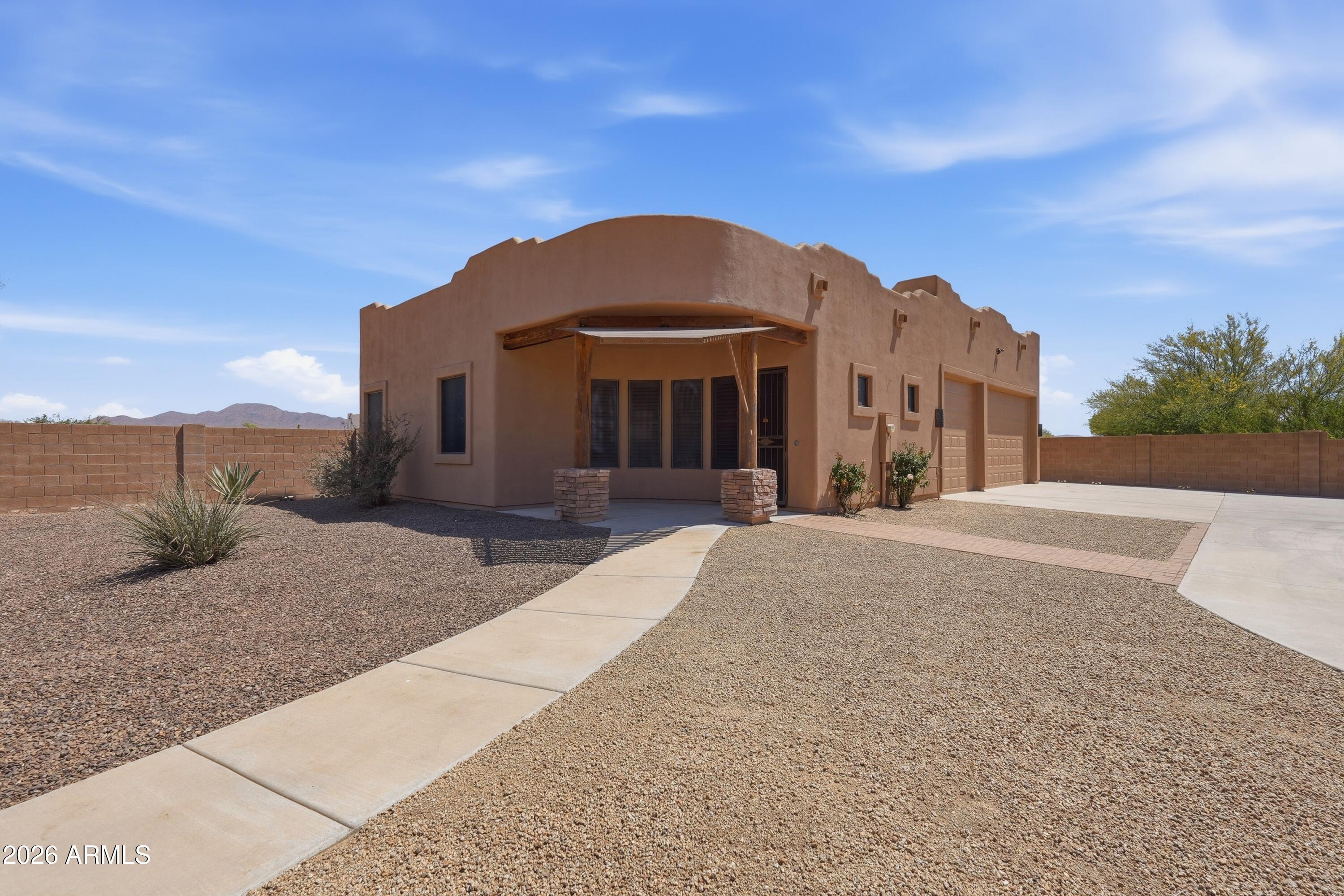 2616 West Canyon Road Phoenix, AZ 85086 - Photo 32 of 45 a view of a house with a yard