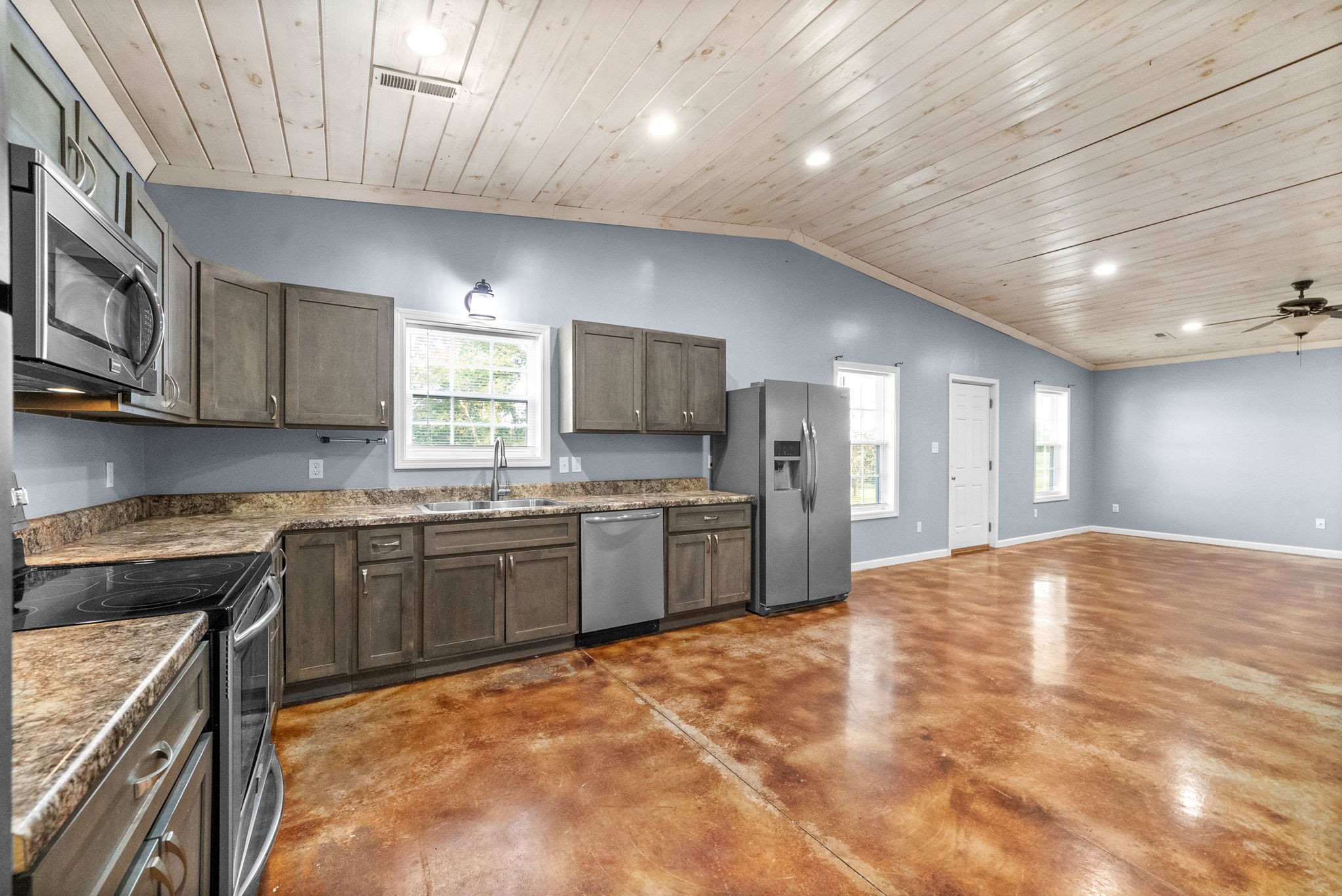 113 Tinsley Drive Pembroke, KY 42266 - Photo 12 of 28 a large kitchen with stainless steel appliances granite countertop a stove cabinets and a sink