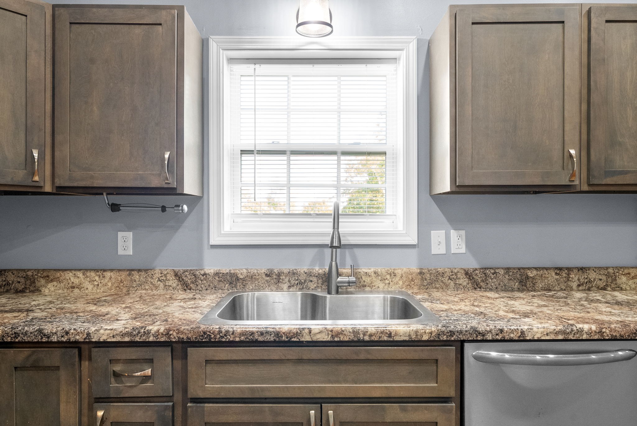 113 Tinsley Drive Pembroke, KY 42266 - Photo 13 of 28 a kitchen with granite countertop cabinets sink and window
