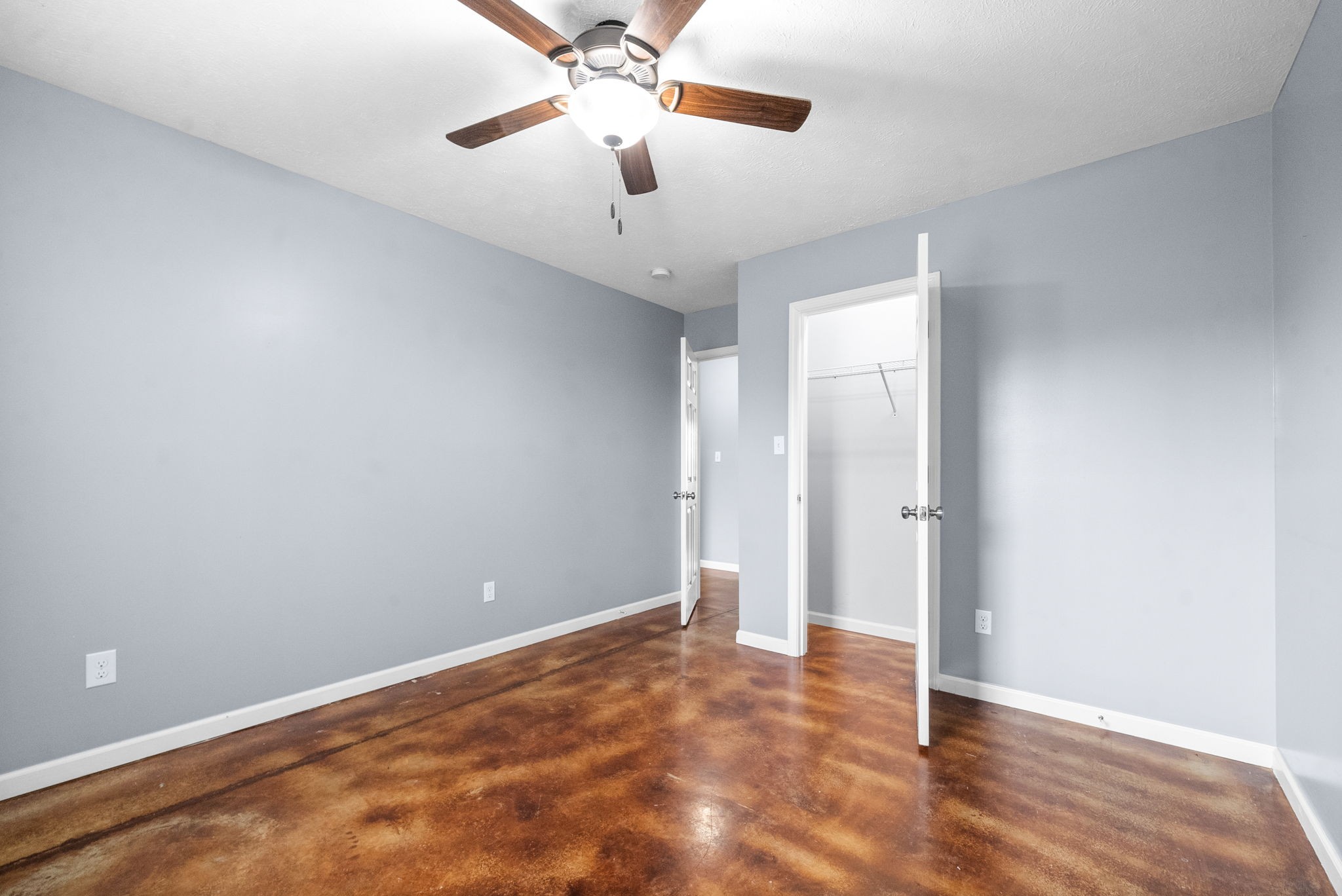 113 Tinsley Drive Pembroke, KY 42266 - Photo 20 of 28 an empty room with closet and a chandelier fan
