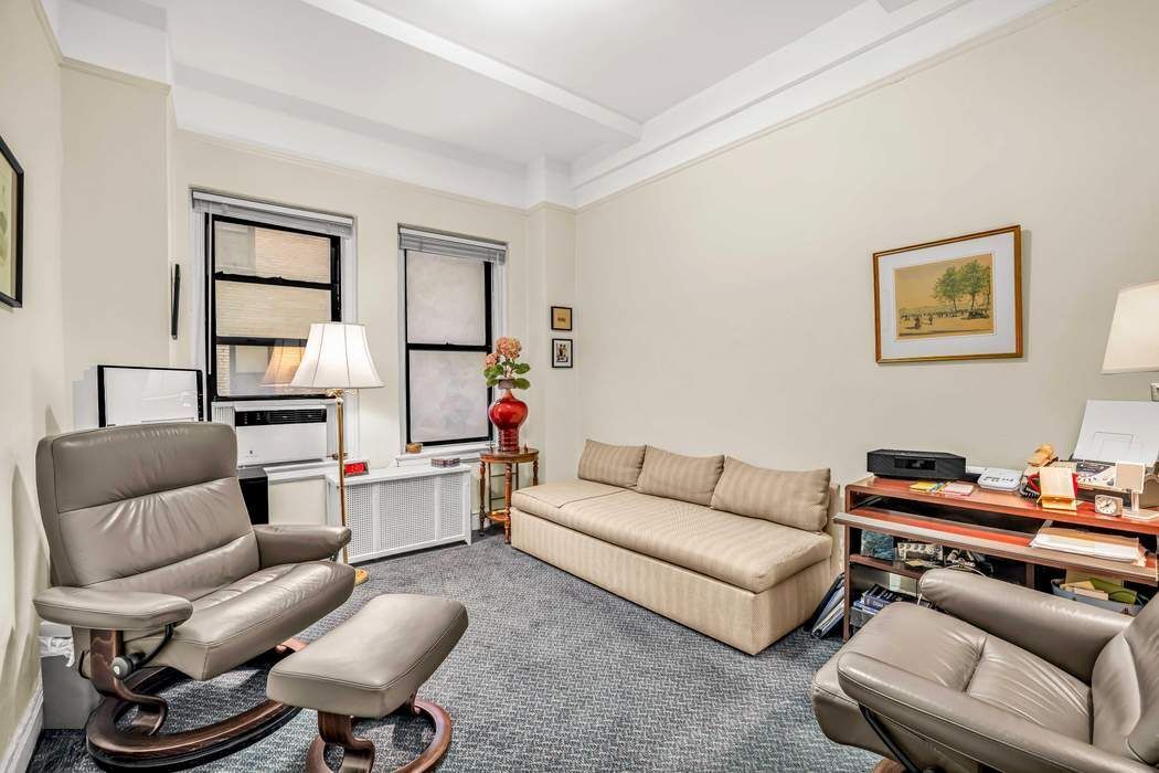 425 East 86th Street, Unit 1B/D Manhattan, NY 10028 - Photo 5 of 10 a living room with furniture and a piano