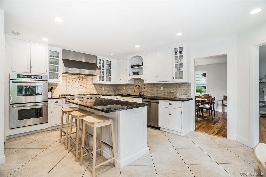 4 Parkfield Road Scarsdale, NY 10583 - Photo 6 of 33 Chef's kitchen with stainless steel appliances and center island with enough room to seat three!