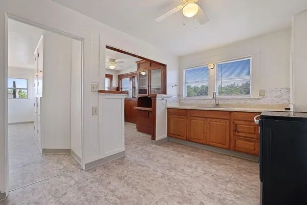 a kitchen with a sink and cabinets