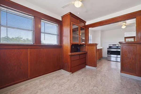 a kitchen with stainless steel appliances granite countertop a refrigerator and a stove