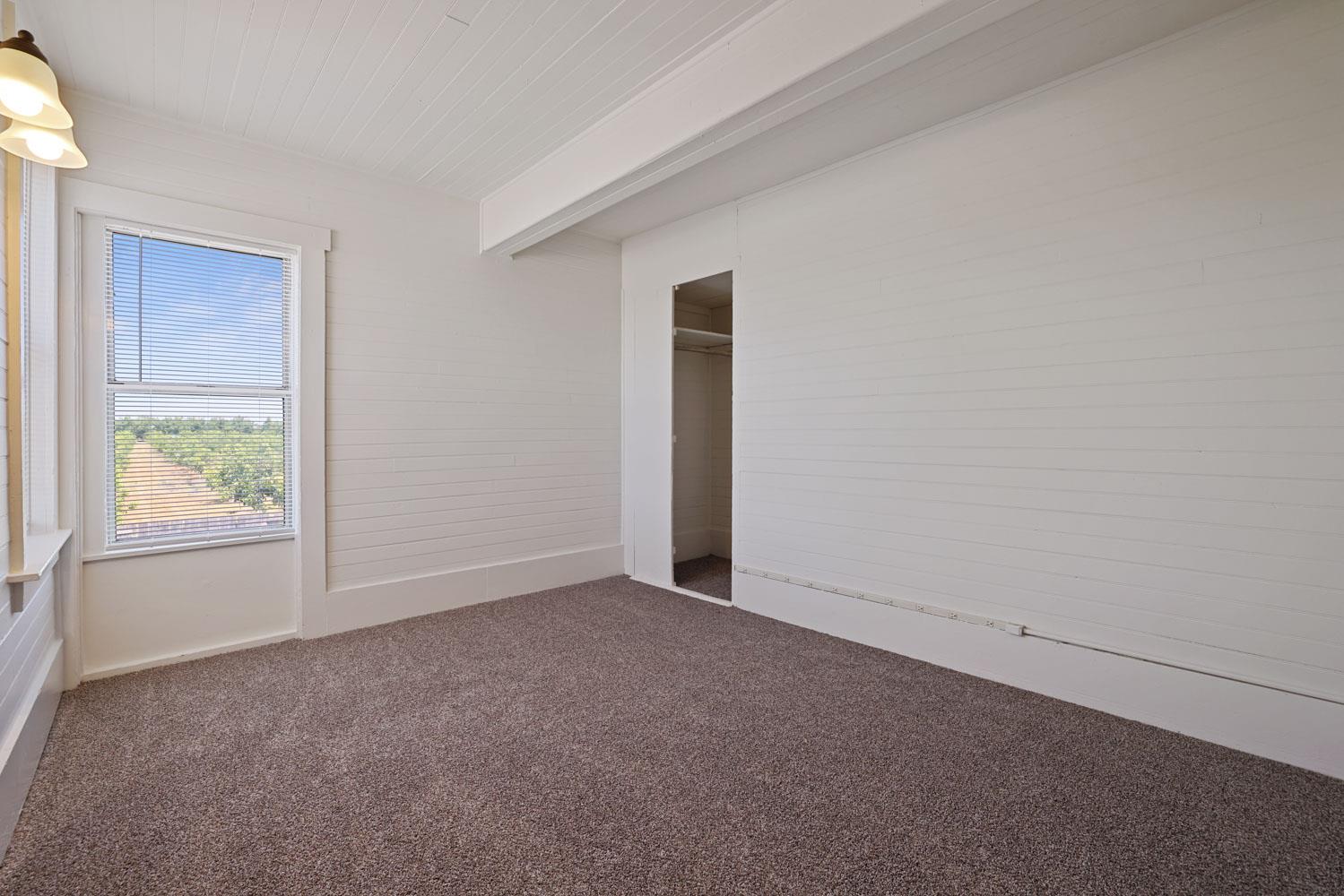 3443 Kansas Avenue Modesto, CA 95358 - Photo 17 of 45 an empty room with windows