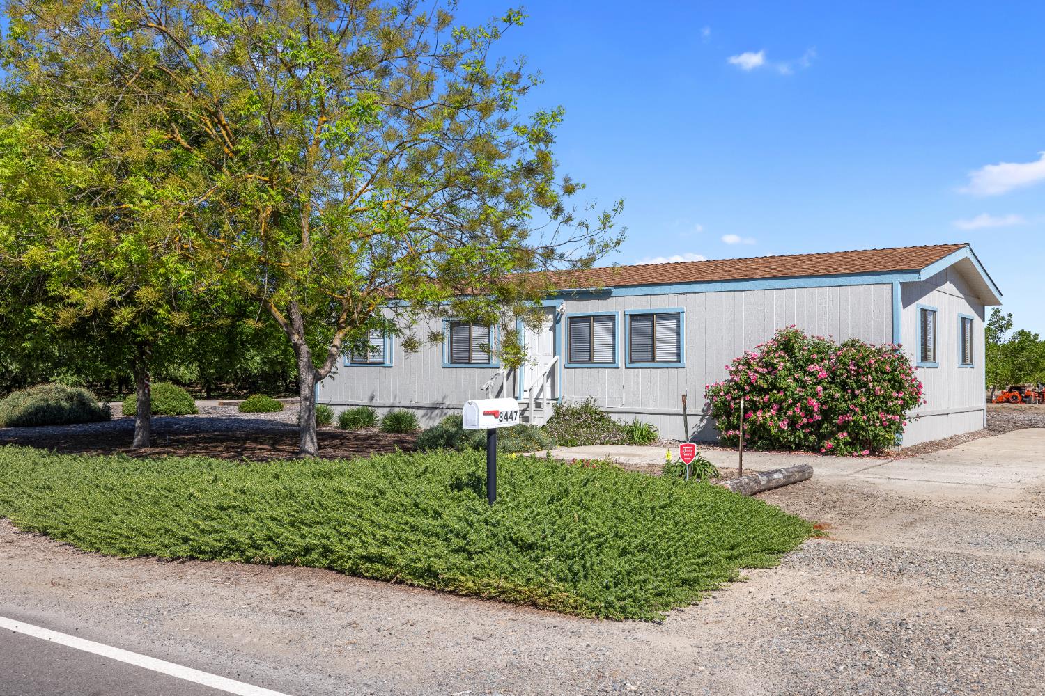 3443 Kansas Avenue Modesto, CA 95358 - Photo 19 of 45 front view of a house with a small yard