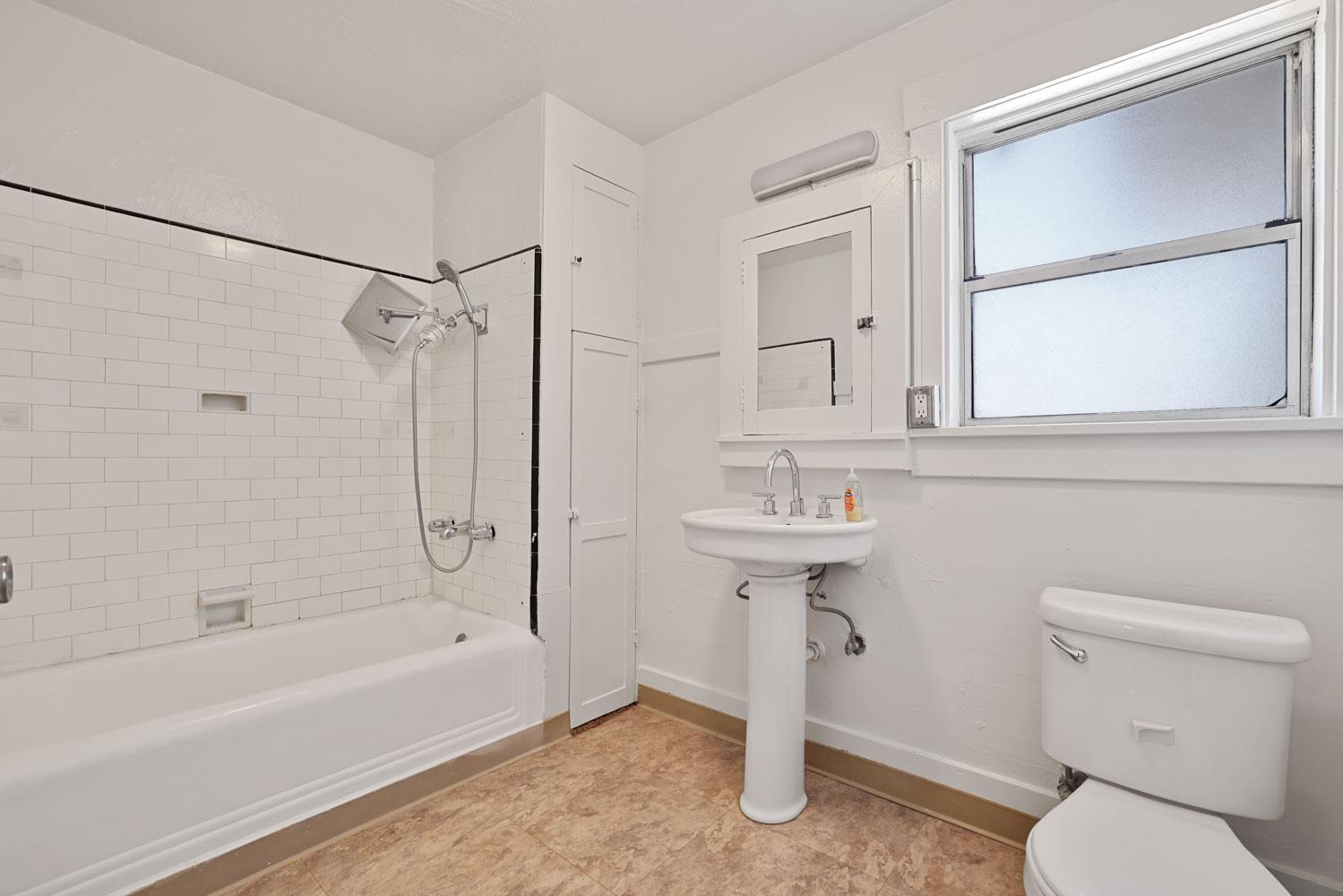 3443 Kansas Avenue Modesto, CA 95358 - Photo 8 of 45 a bathroom with a sink toilet and shower