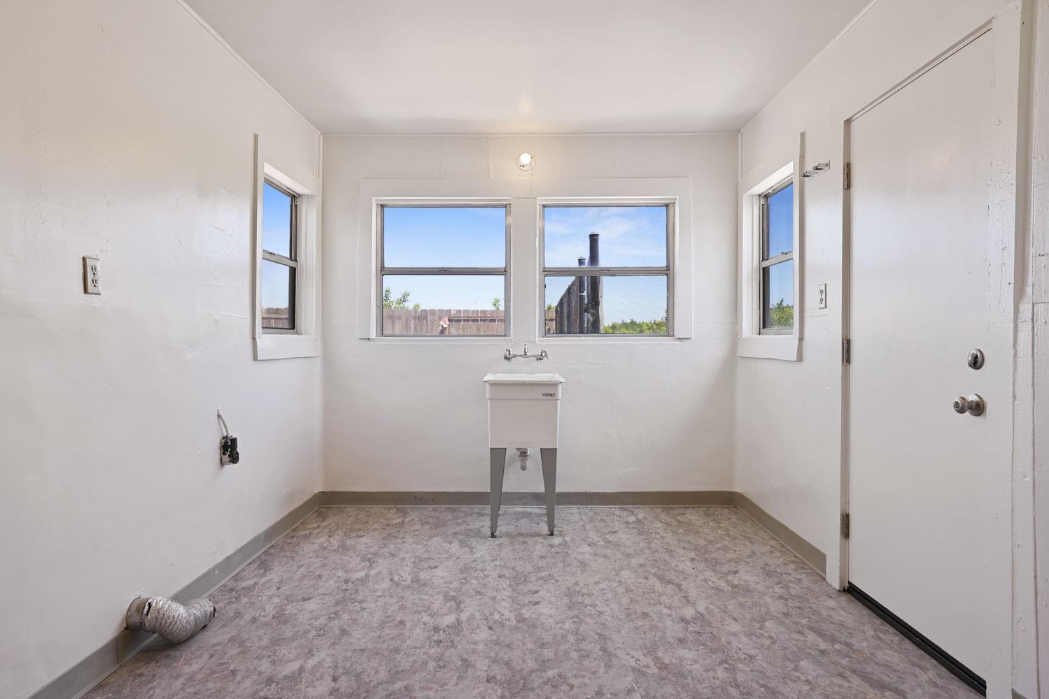 3443 Kansas Avenue Modesto, CA 95358 - Photo 9 of 45 an empty room with windows and cabinet