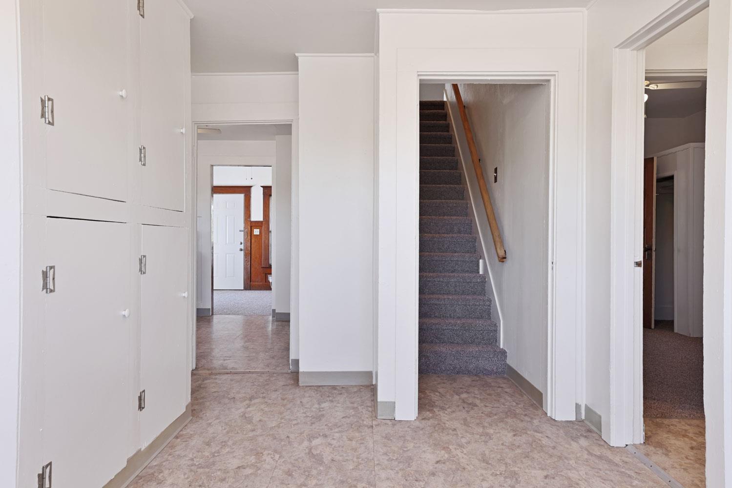 3443 Kansas Avenue Modesto, CA 95358 - Photo 10 of 45 en view of a hallway with a room and stairs