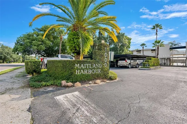 a view of a street with a building and a street sign