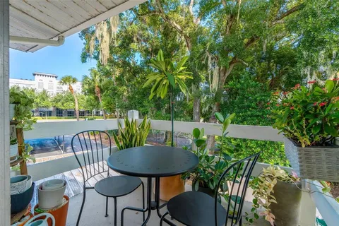 a view of a table and chairs in the patio