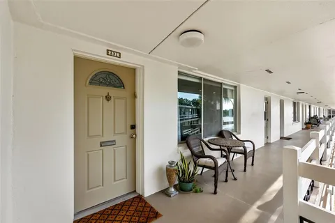 a view of a livingroom with furniture and entryway