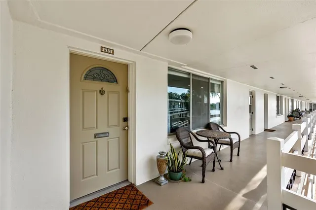 a view of a livingroom with furniture and entryway