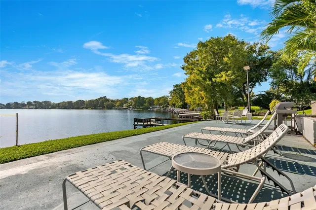 a view of swimming pool with outdoor seating and yard