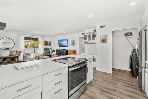 a kitchen with a stove and a refrigerator