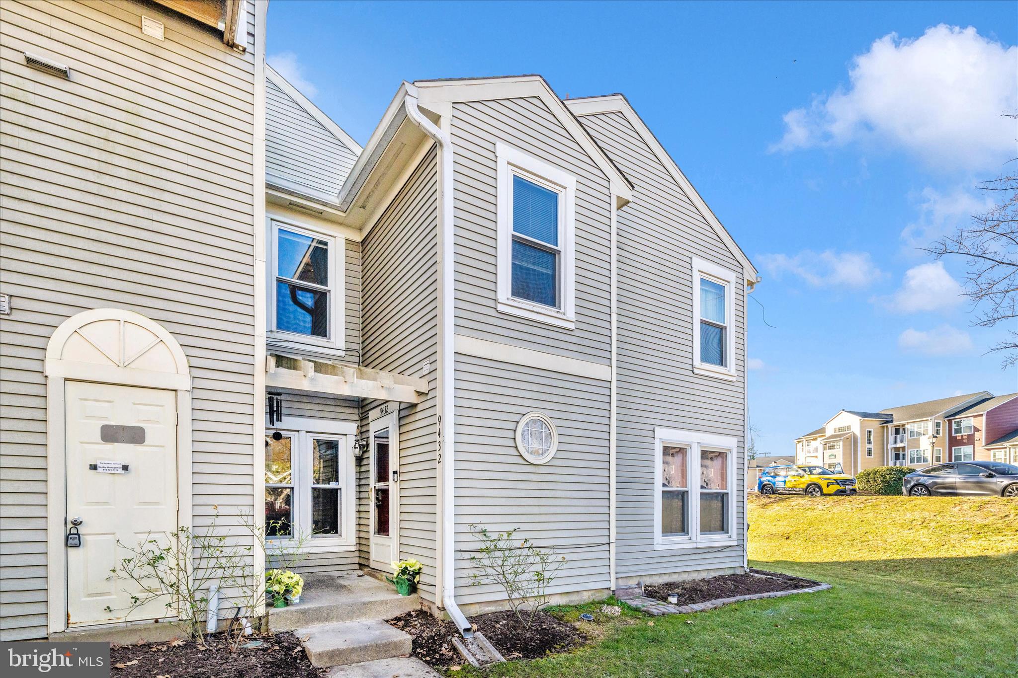a front view of a house with a yard