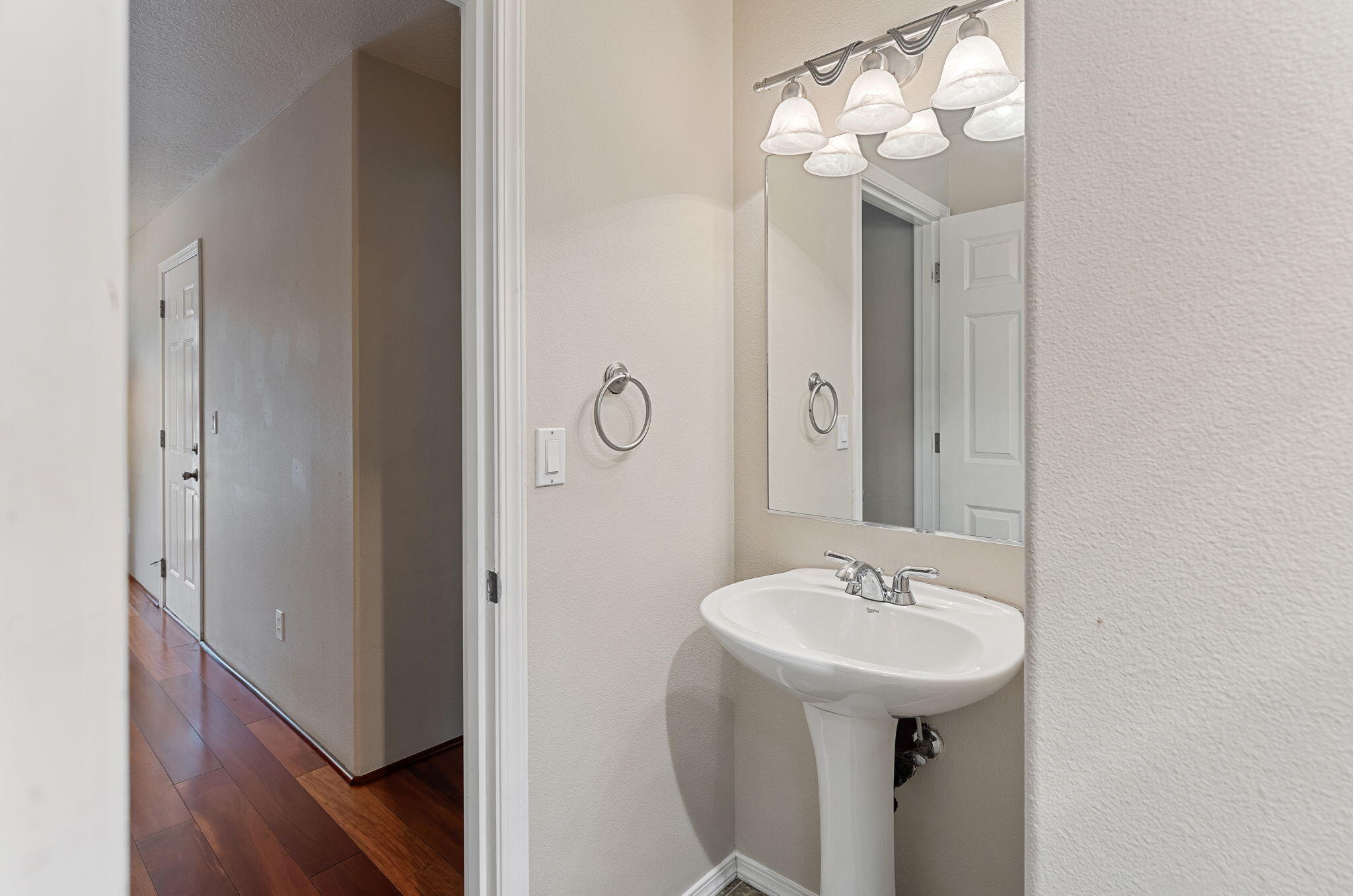 1134 Lincoln Road Grants Pass, OR 97526 - Photo 10 of 25 Downstairs has powder room with laundry cupboard access