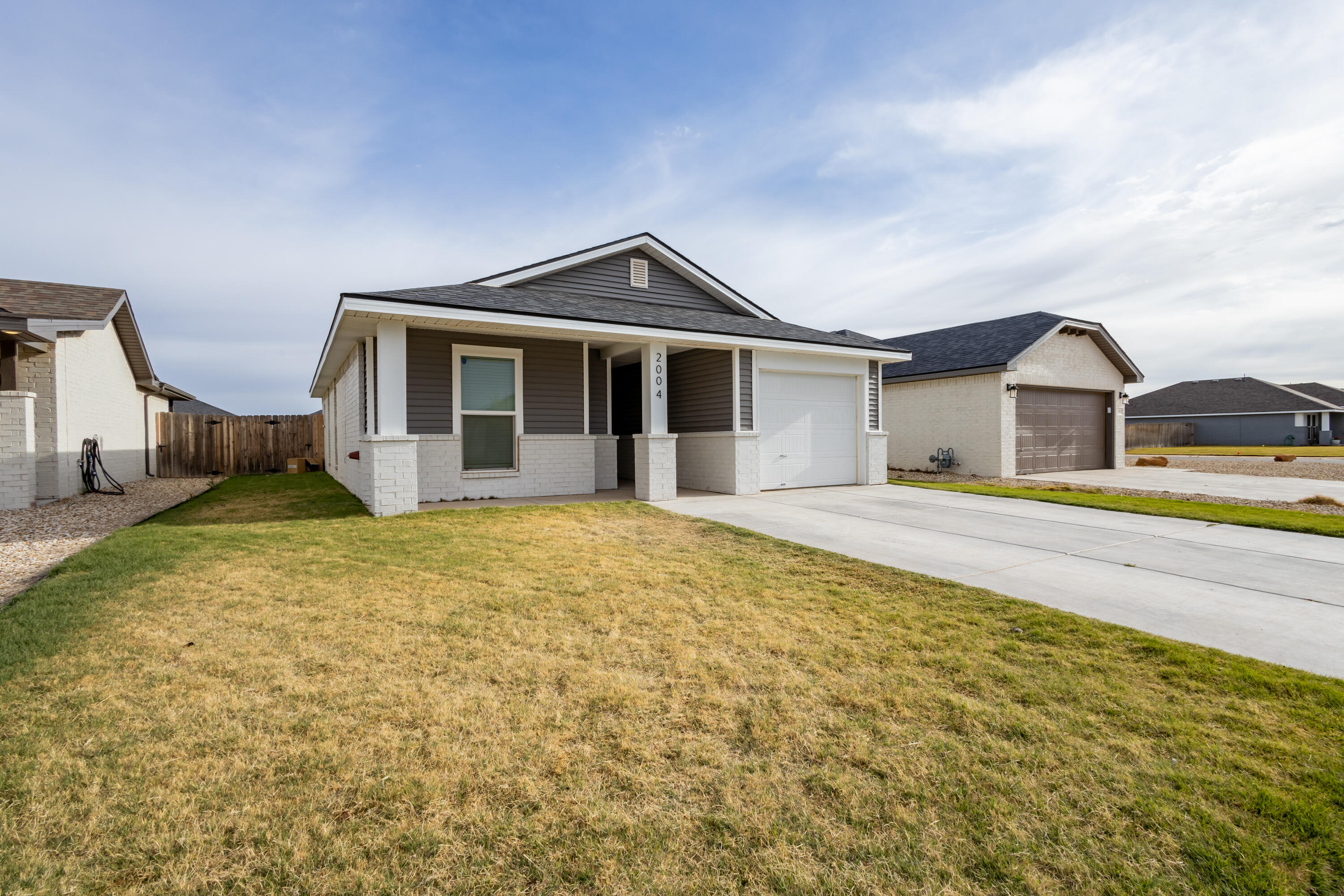 2004 134th Street Lubbock, TX 79423 - Photo 2 of 17 a front view of a house with garden
