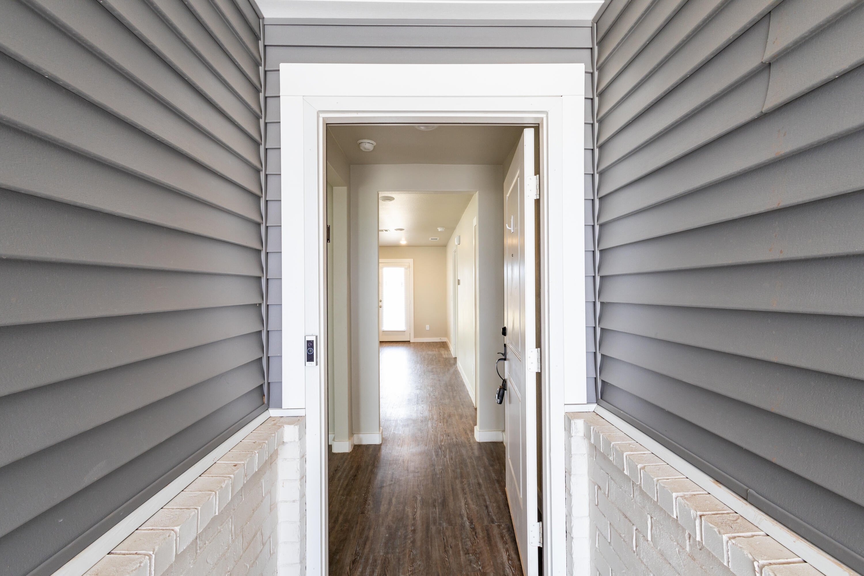 2004 134th Street Lubbock, TX 79423 - Photo 3 of 17 a view of a hallway with wooden floor and staircase