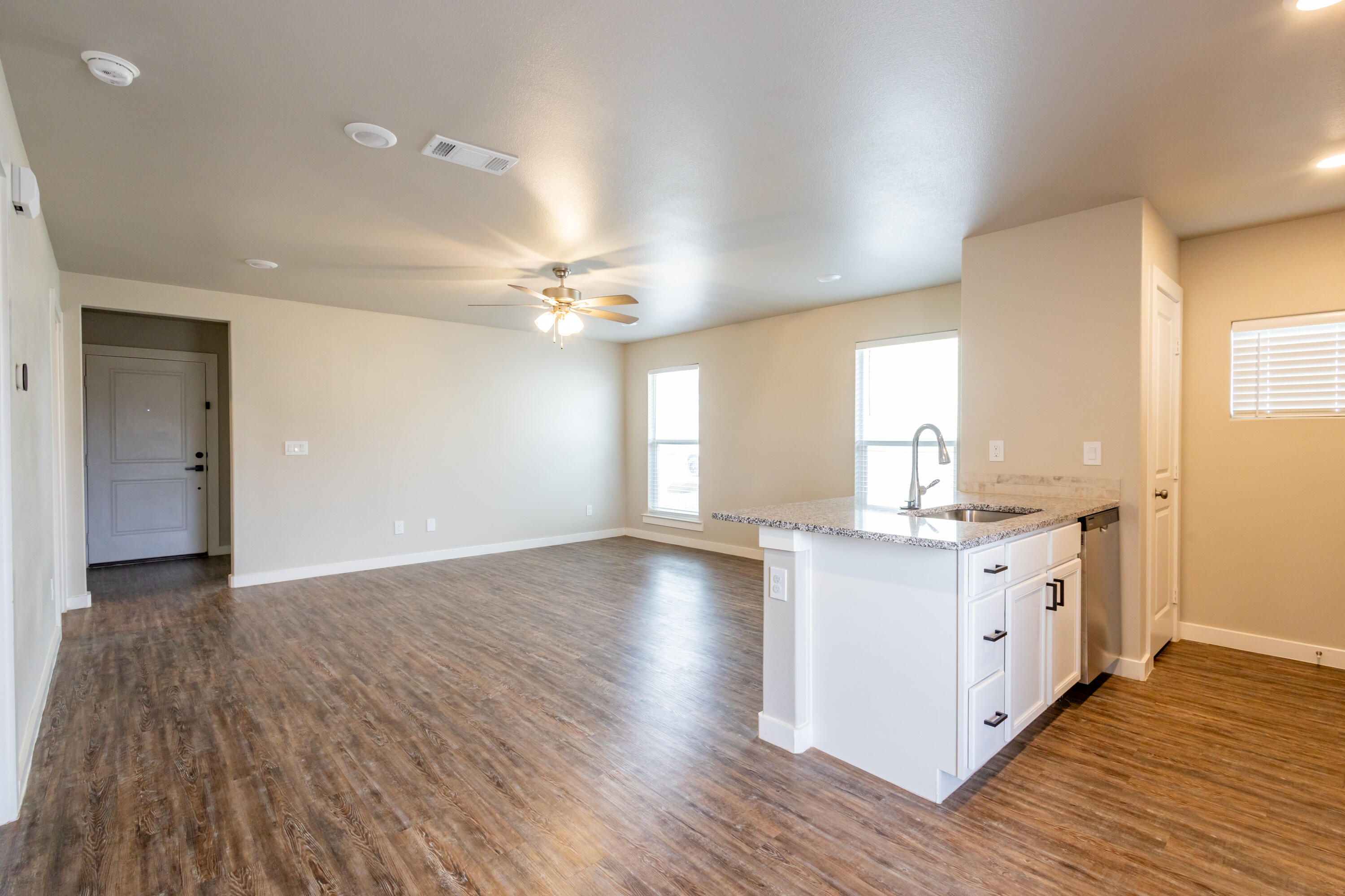 2004 134th Street Lubbock, TX 79423 - Photo 6 of 17 a view of a kitchen counter space a sink and wooden floor