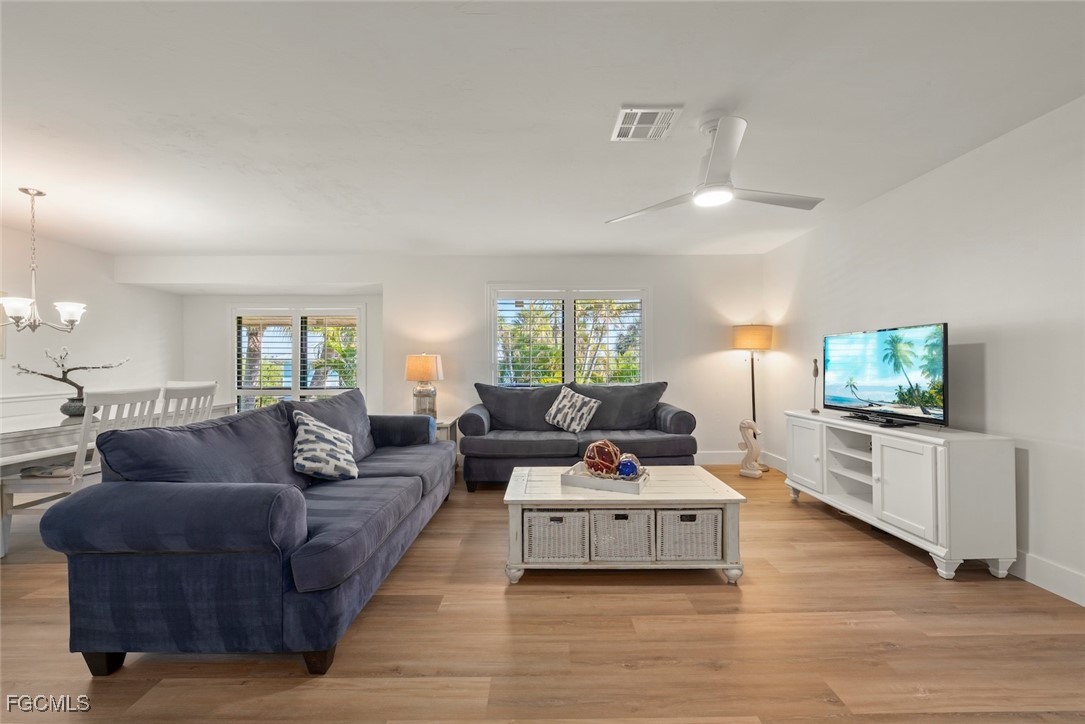 5117 Sea Bell Road, Unit D204 Sanibel, FL 33957 - Photo 1 of 48 a living room with furniture and a flat screen tv