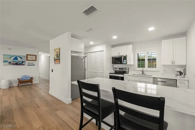 a kitchen with a table and chairs in it