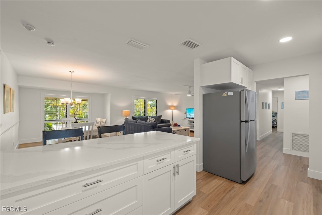 5117 Sea Bell Road, Unit D204 Sanibel, FL 33957 - Photo 19 of 48 a kitchen with sink refrigerator and window