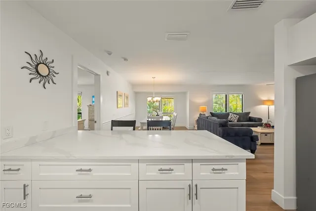 a kitchen with cabinets appliances and a counter top space