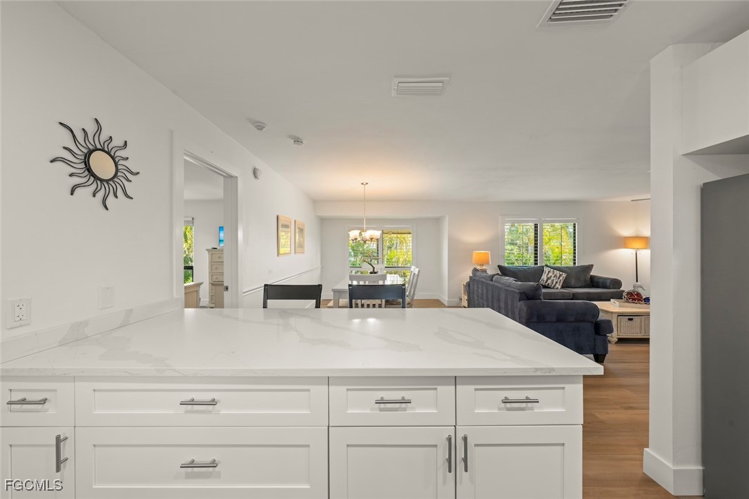 5117 Sea Bell Road, Unit D204 Sanibel, FL 33957 - Photo 21 of 50 a kitchen with cabinets appliances and a counter top space