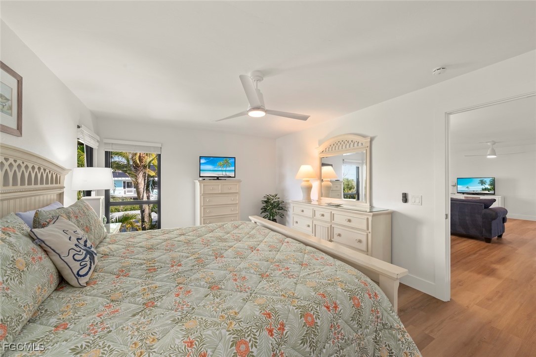 5117 Sea Bell Road, Unit D204 Sanibel, FL 33957 - Photo 27 of 48 a bedroom with a large bed and a view of bedroom