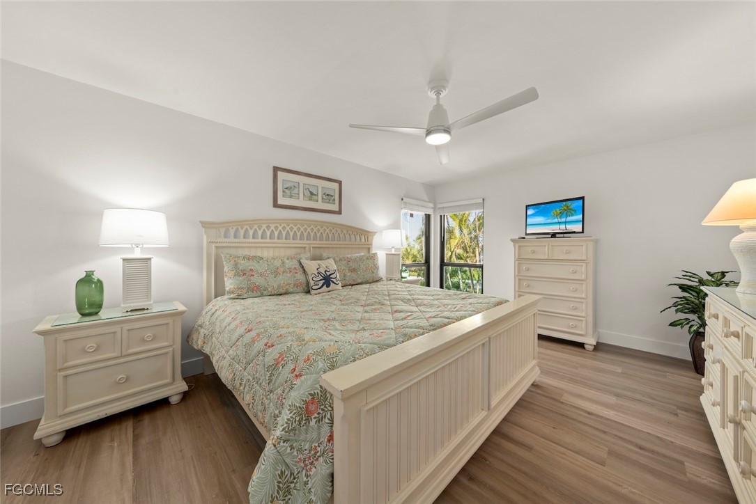 5117 Sea Bell Road, Unit D204 Sanibel, FL 33957 - Photo 28 of 48 a bedroom with a bed and a closet