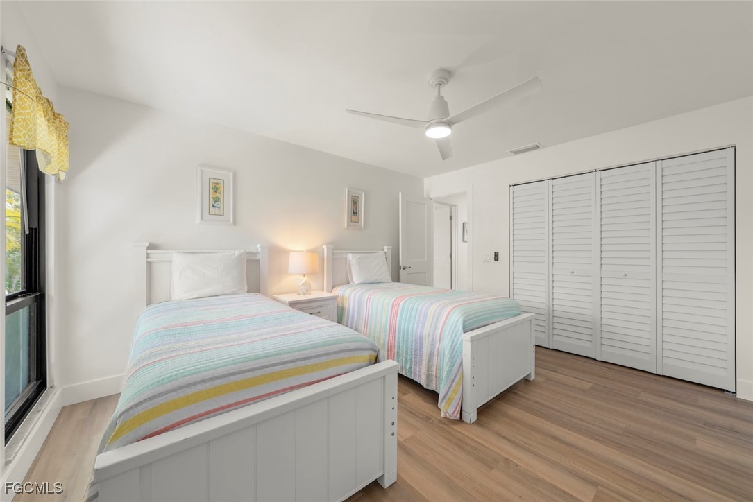 5117 Sea Bell Road, Unit D204 Sanibel, FL 33957 - Photo 33 of 48 a spacious bedroom with two beds and painted walls
