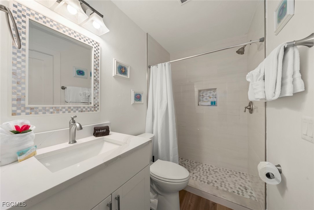 5117 Sea Bell Road, Unit D204 Sanibel, FL 33957 - Photo 36 of 48 a bathroom with a sink toilet and shower