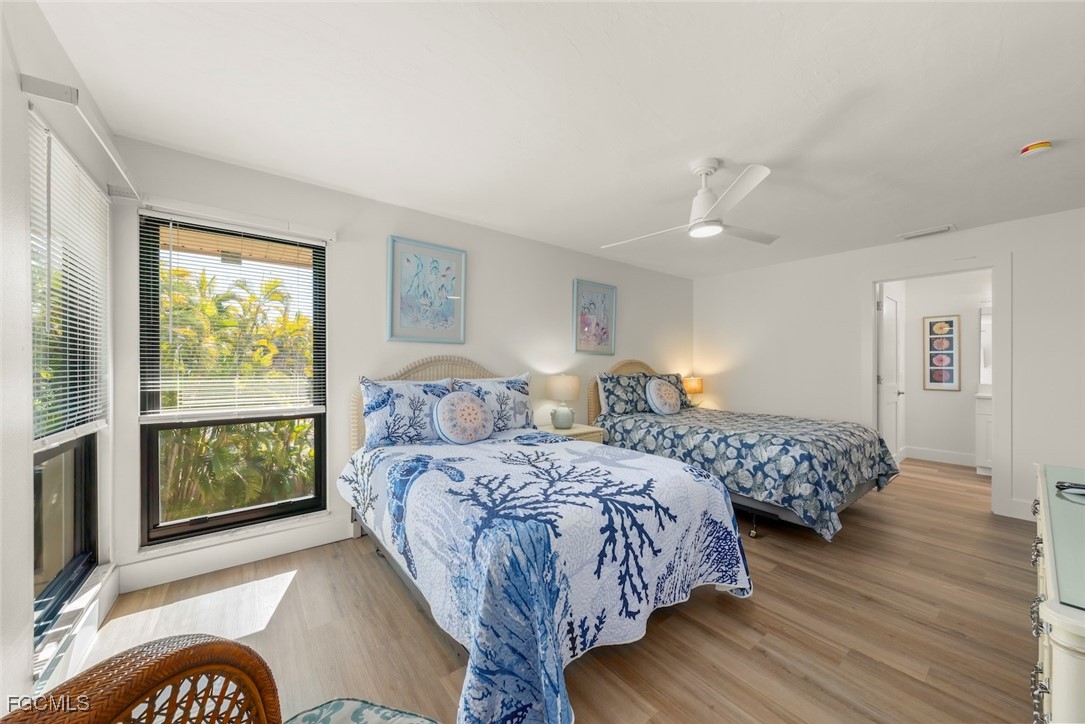 5117 Sea Bell Road, Unit D204 Sanibel, FL 33957 - Photo 39 of 48 a bedroom with two beds and a window